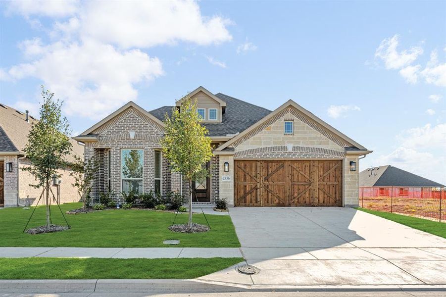 Front exterior of a new home in Stone River Glen 50s, Royse City, TX, highlighting curb appeal (Image 2). Front exterior of a new home in Stone River Glen 50s, Royse City, TX, highlighting curb appeal (Image 2).