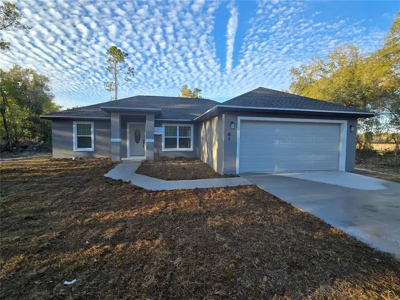 Front exterior of a new home in , Ocala, FL, highlighting curb appeal (Image 1). Front exterior of a new home in , Ocala, FL, highlighting curb appeal (Image 1).