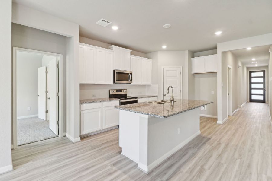 Kitchen in the Callaghan floorplan at a Meritage Homes community.