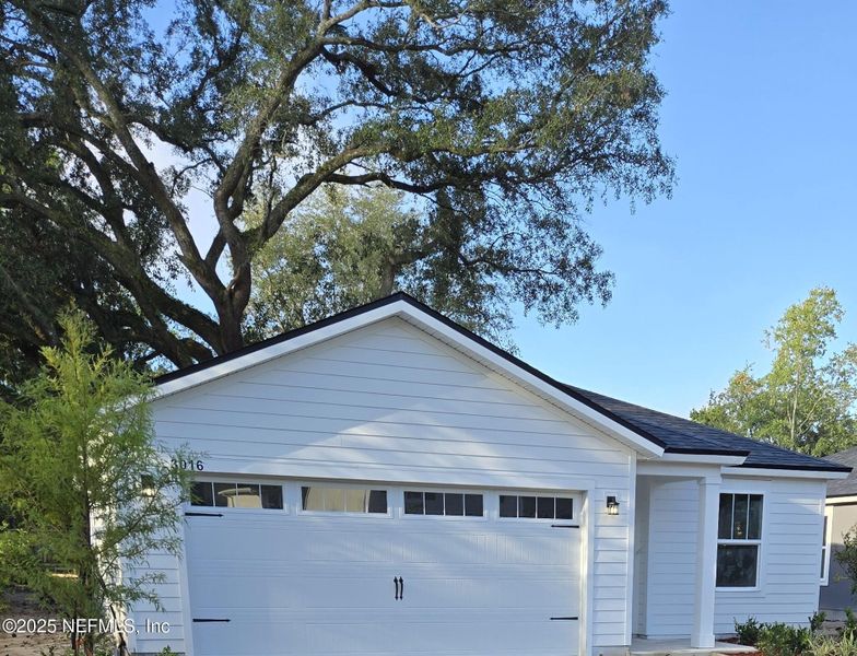 Front exterior of a new home in , Jacksonville, FL, highlighting curb appeal (Image 2).