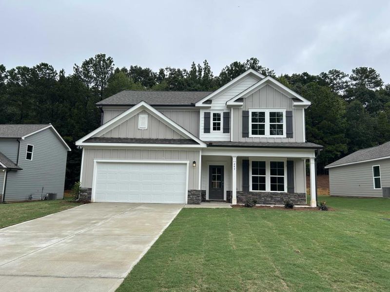 Front exterior of a new home in Sutton's Landing, Statham, GA, highlighting curb appeal (Image 12).