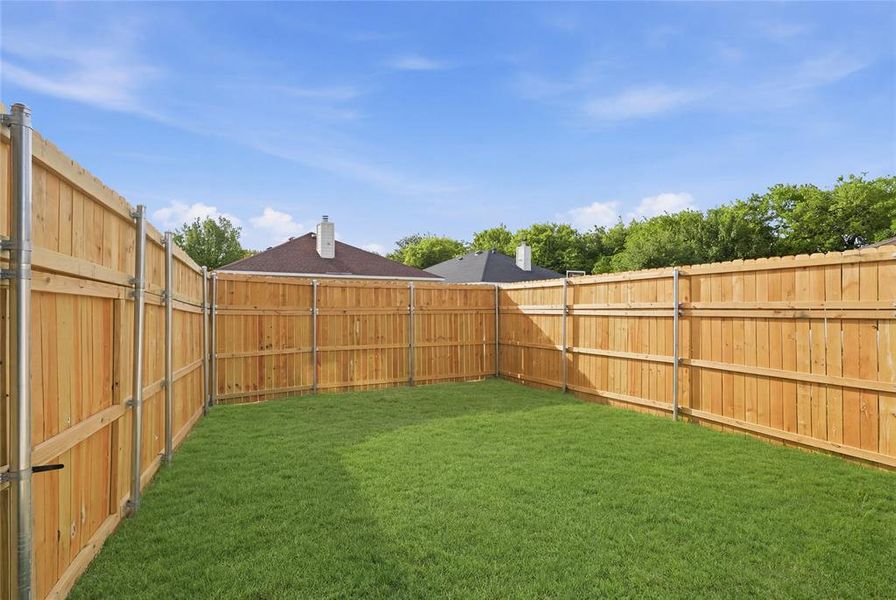 View of fenced backyard