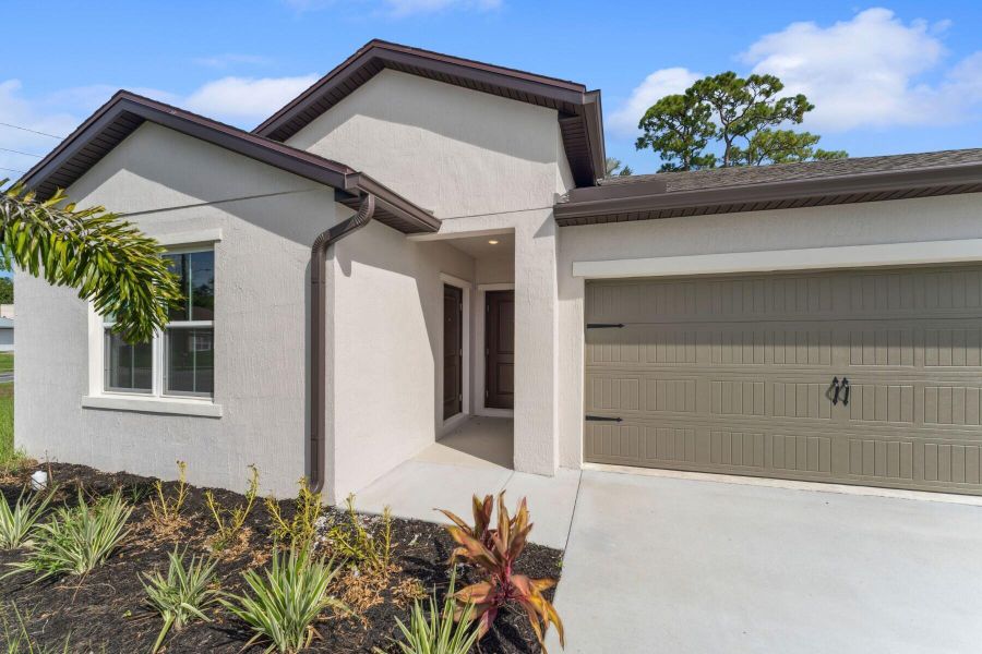 Front exterior of a new home in , Port St. Lucie, FL, highlighting curb appeal (Image 1). Front exterior of a new home in , Port St. Lucie, FL, highlighting curb appeal (Image 1).
