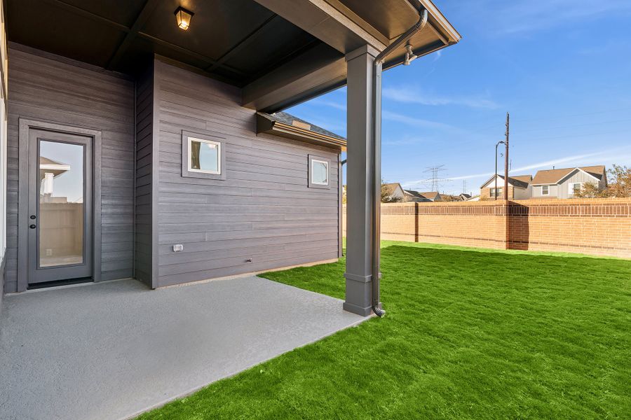 Exterior details and patio area of a home in Elyson 45', Katy (Image 4).