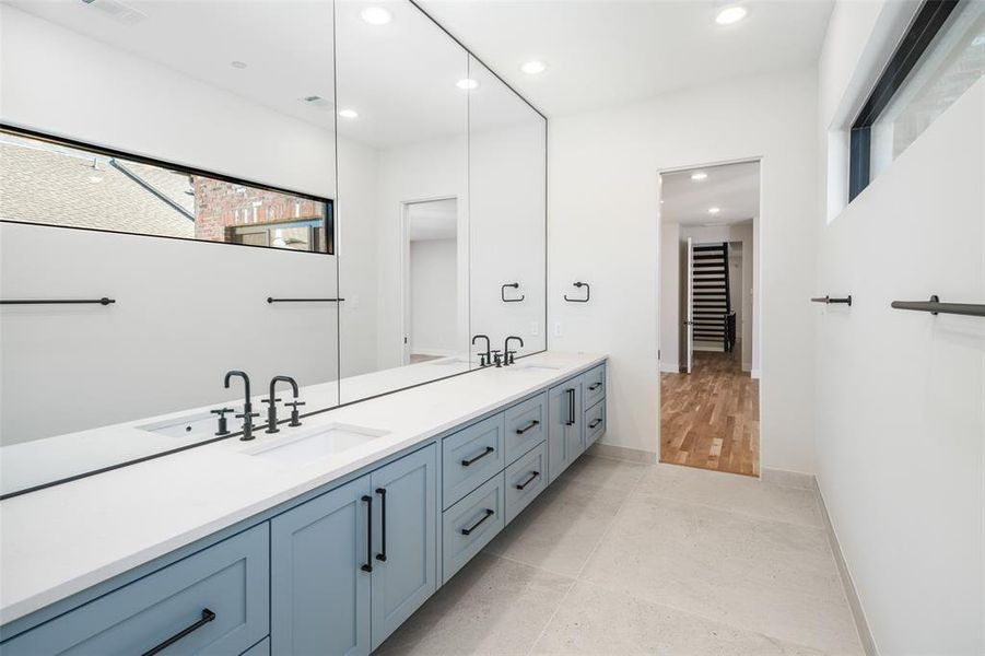 Bathroom featuring tile patterned flooring and vanity