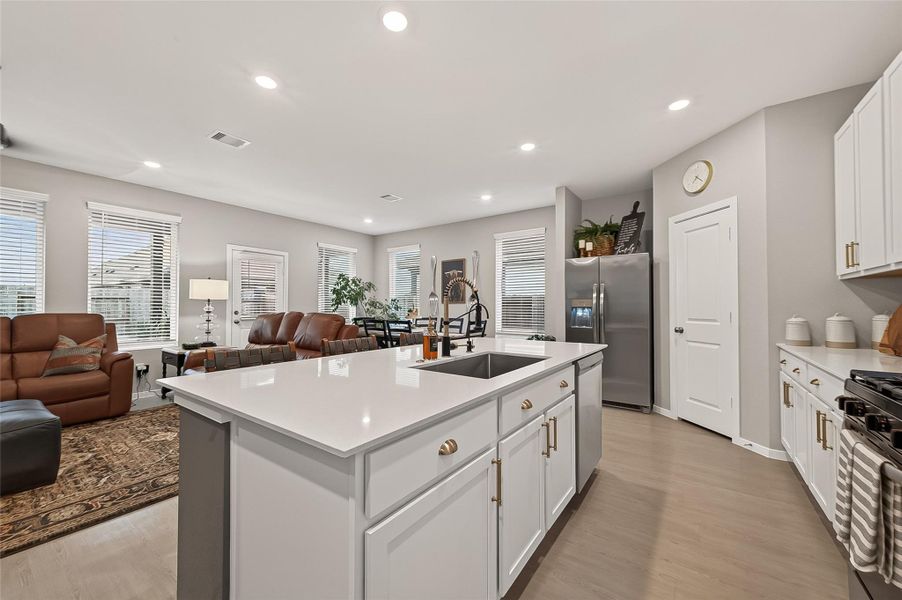 Spacious kitchen featuring a large center island and abundant cabinet storage. Spacious kitchen featuring a large center island and abundant cabinet storage.