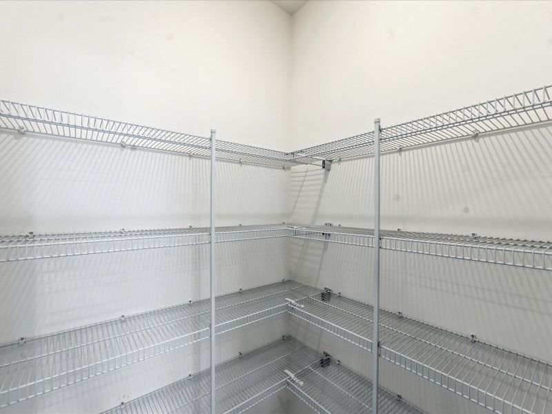 Spacious, unfurnished interior of a new home in The Coves at Lakes of Cane Bay II, Summerville (Image 37).