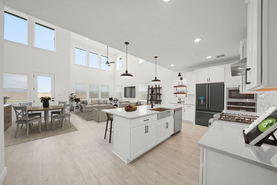 Stylish kitchen open to the living area (*Photo not of actual home and used for illustration purposes only.)