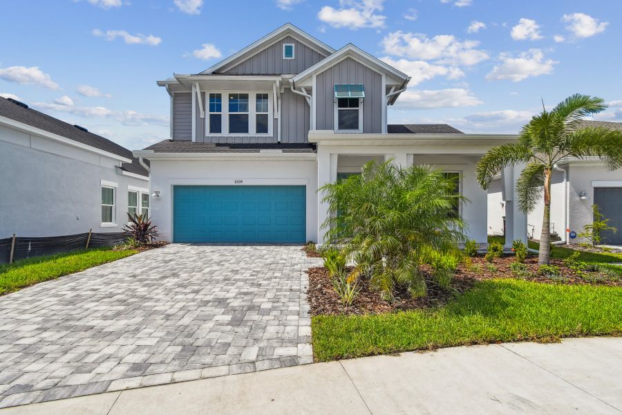 Representative exterior photo of a completed home built from the The Flatwater by David Weekley Homes in Emerald Landing at Waterside at Lakewood Ranch – Lake Series, Sarasota, FL (Image 1).