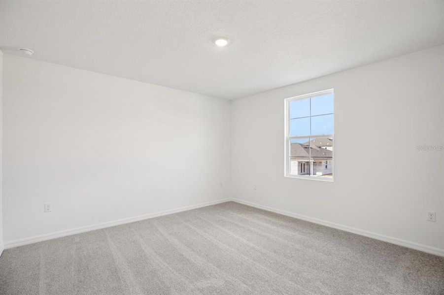 Spacious, unfurnished interior of a new home in Northlake at Ovation, Winter Garden (Image 31).