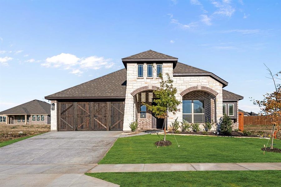 Front exterior of a new home in Star Ranch Classic 50, Godley, TX, highlighting curb appeal (Image 1). Front exterior of a new home in Star Ranch Classic 50, Godley, TX, highlighting curb appeal (Image 1).