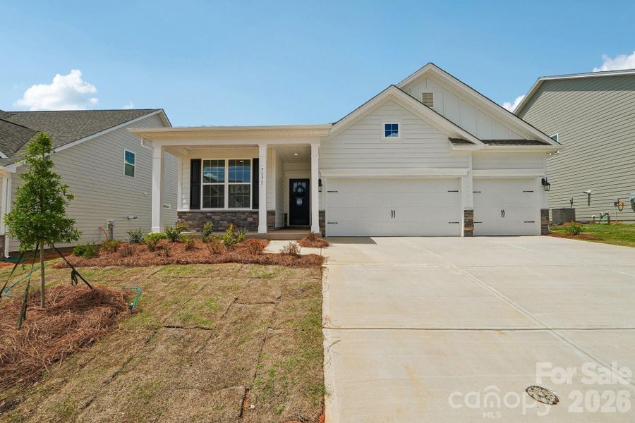 Front exterior of a new home in Sylvan Creek, Denver, NC, highlighting curb appeal (Image 26). Front exterior of a new home in Sylvan Creek, Denver, NC, highlighting curb appeal (Image 26).