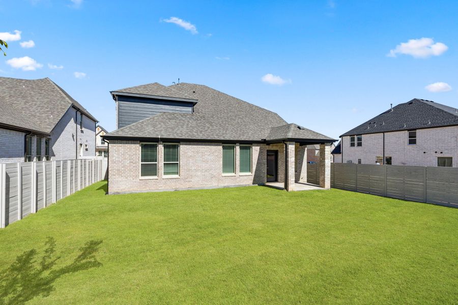 Exterior details and patio area of a home in Painted Tree Woodland West, McKinney (Image 3).