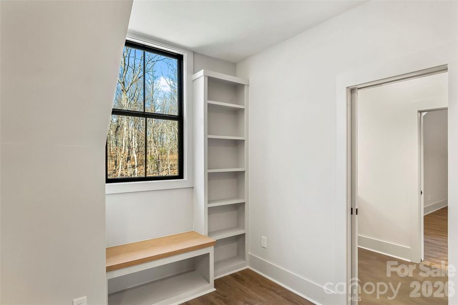 Built-in features in the upstairs bedrooms that share a jack-and-jill bath.