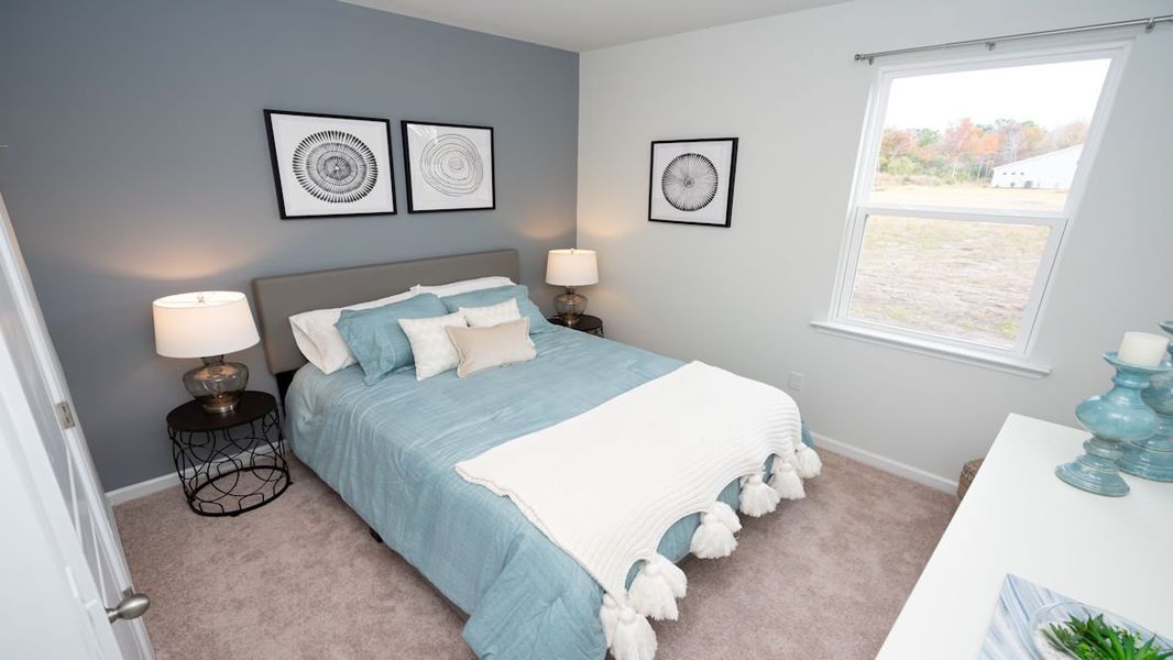 Representative furnished interior of a home built from the KERRY by D.R. Horton in Lochaven, Conway (Image 11).