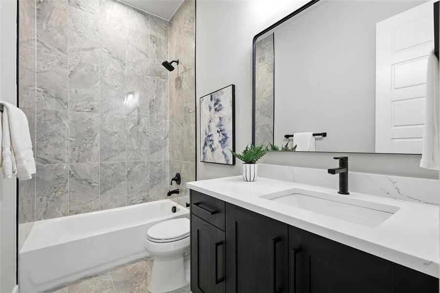 Full bath featuring vanity and shower / bathtub combination