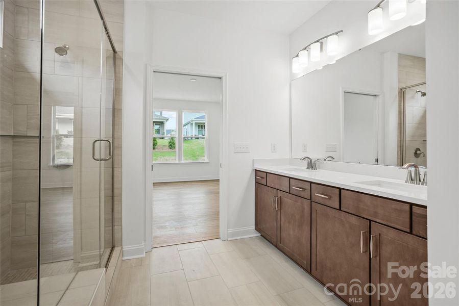 Primary bathroom connects to walk-in closet Primary bathroom connects to walk-in closet