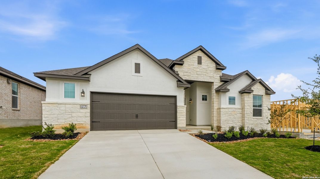 Front exterior of a new home in Esperanza 50's, Boerne, TX, highlighting curb appeal (Image 1). Front exterior of a new home in Esperanza 50's, Boerne, TX, highlighting curb appeal (Image 1).