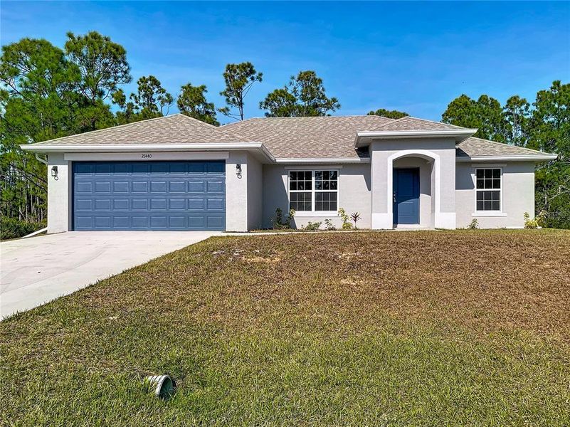 Front exterior of a new home in , Punta Gorda, FL, highlighting curb appeal (Image 20).