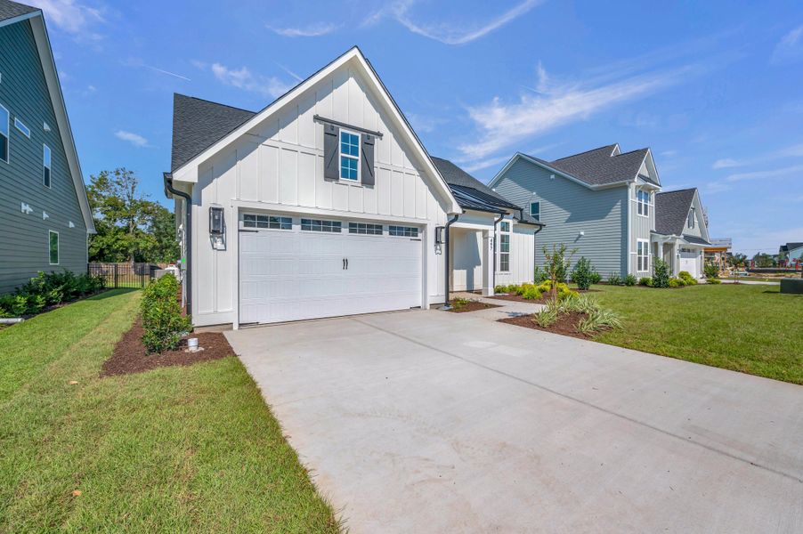 Representative exterior photo of a completed home built from the The Bradley by RobuckHomes in Windwater, Hampstead, NC (Image 30).