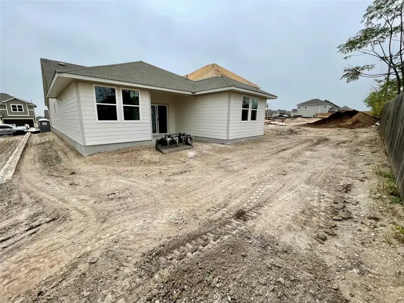 Exterior details and patio area of a home in Covered Bridge, Hutto (Image 2).
