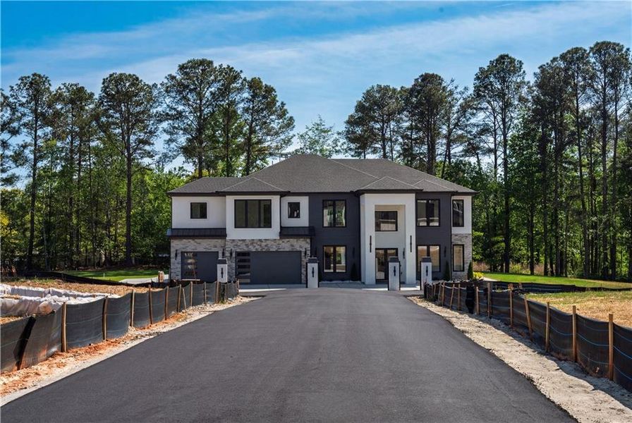 Front exterior of a new home in , Buford, GA, highlighting curb appeal (Image 27).