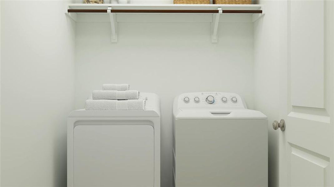 Laundry room with laundry area and washer and clothes dryer