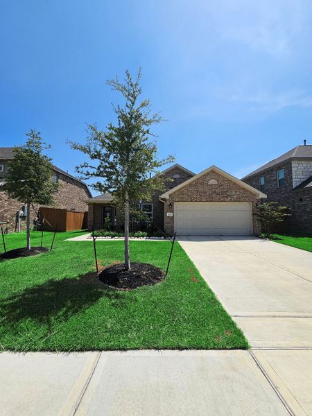 Front exterior of a new home in Lago Mar, Texas City, TX, highlighting curb appeal (Image 1). Front exterior of a new home in Lago Mar, Texas City, TX, highlighting curb appeal (Image 1).