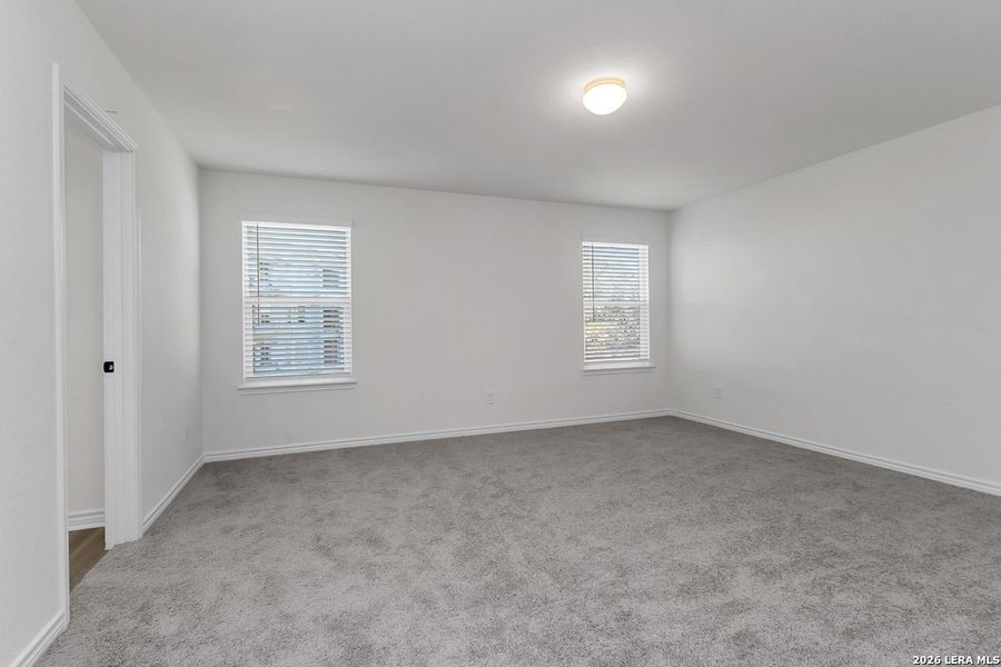 Spacious, unfurnished interior of a new home in Preserve at Culebra - Heritage Collection, San Antonio (Image 14).