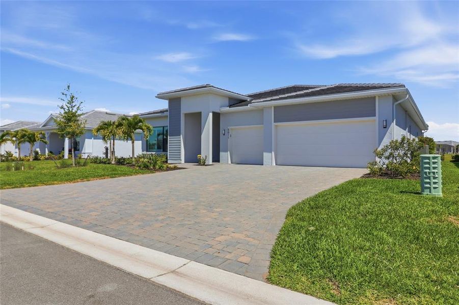 Front exterior of a new home in , Lakewood Ranch, FL, highlighting curb appeal (Image 20).