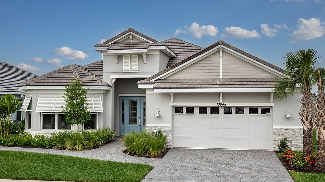 Representative exterior photo of a completed home built from the Pallazio by Taylor Morrison in Astor Creek Golf and Country Club, Port St. Lucie, FL (Image 25).