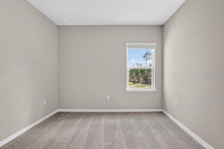 Spacious, unfurnished interior of a new home in Ardisia Park, New Smyrna Beach (Image 25).