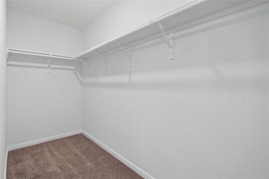 Look at this immaculate closet! With high shelving, multiple rows to hang clothing, you are sure to have enough room for all your belongings!