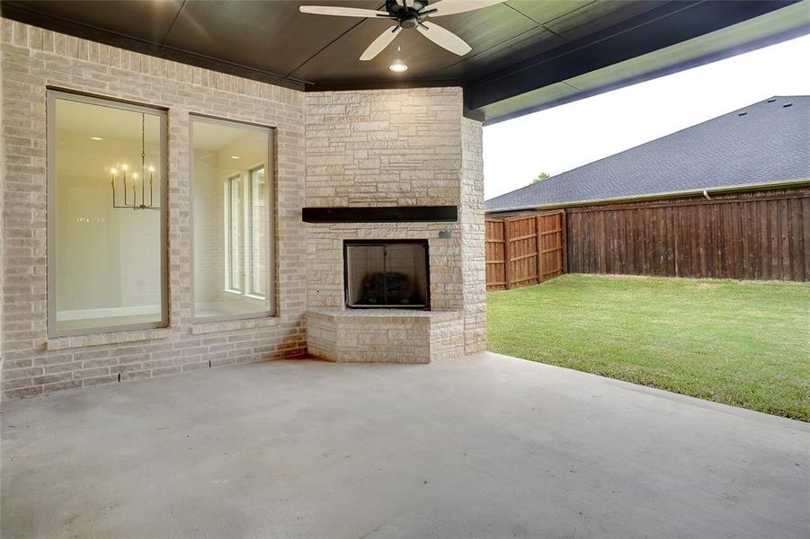Enjoy your mornings and evenings on this amazing covered patio. Patio includes gas fireplace with log set, stained mantel and electric outlet. Enjoy your mornings and evenings on this amazing covered patio. Patio includes gas fireplace with log set, stained mantel and electric outlet.