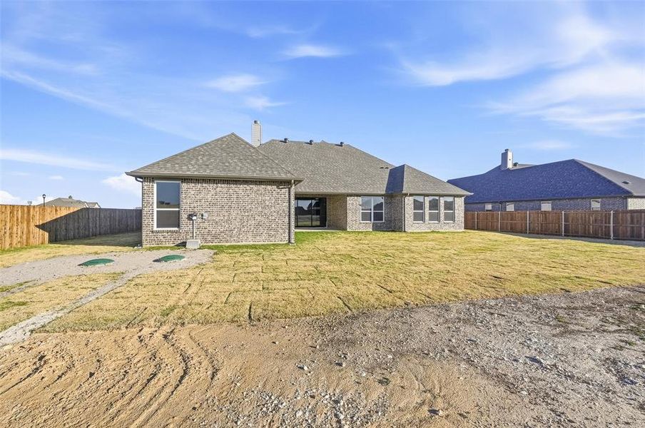 Exterior details and patio area of a home in Coyote Crossing, Godley (Image 25).