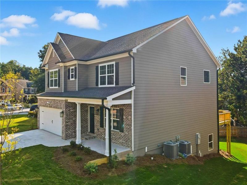 Front exterior of a new home in , Canton, GA, highlighting curb appeal (Image 31).
