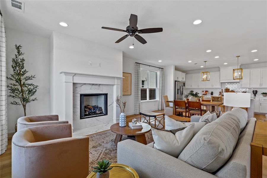 Adjacent to kitchen and dining, and this photo depicts how furniture might be laid out in this room