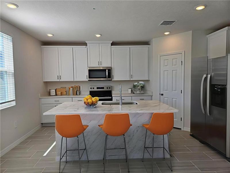 Furnished interior view inside a new home in Lawson Dunes - Signature Series, Haines City (Image 16).