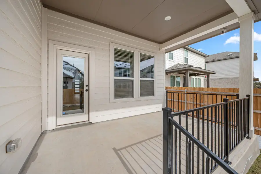 Exterior details and patio area of a home in Heritage, Dripping Springs (Image 3).
