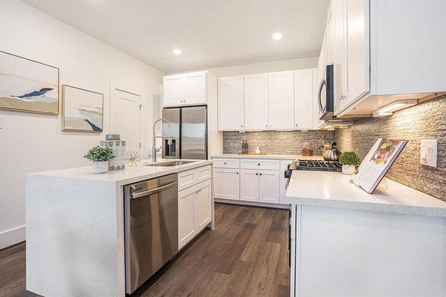 Open Kitchen. Model Home. Same floor plan. Finishes of home may vary.