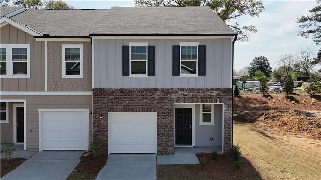 Front exterior of a new home in Kingston Cove, Auburn, GA, highlighting curb appeal (Image 2). Front exterior of a new home in Kingston Cove, Auburn, GA, highlighting curb appeal (Image 2).
