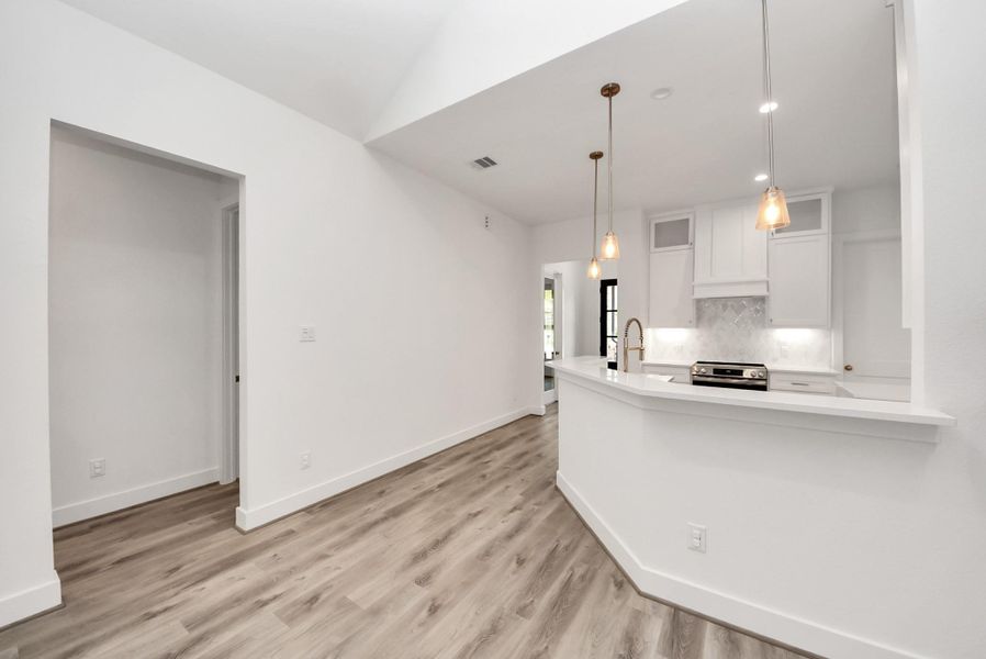 Open living space with easy access to kitchen and dining areas.