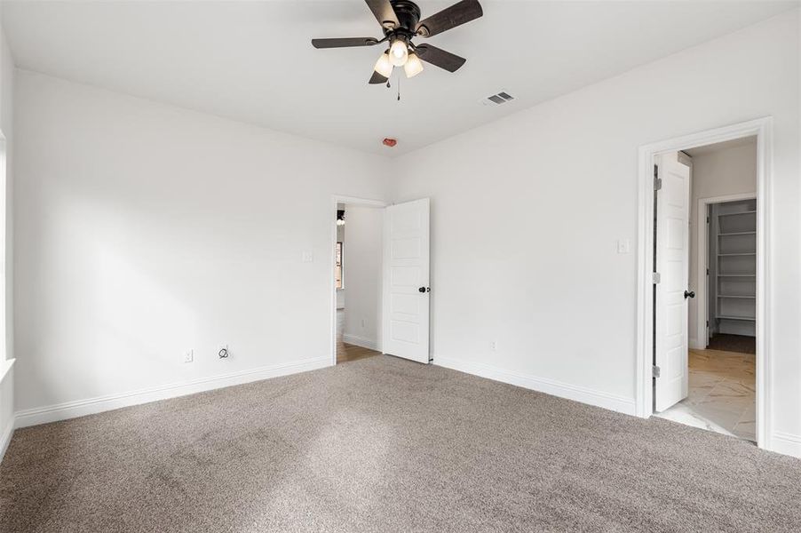 Primary Bedroom with ceiling fan.