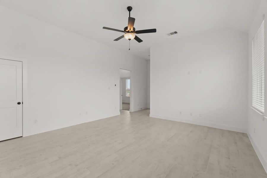 Representative unfurnished interior of a home built from the Pinehurst by Chesmar Homes in Riceland Alley Loads, Mont Belvieu (Image 19).