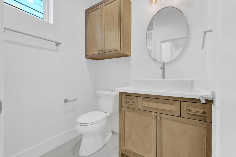 First floor full bathroom with custom finishes.