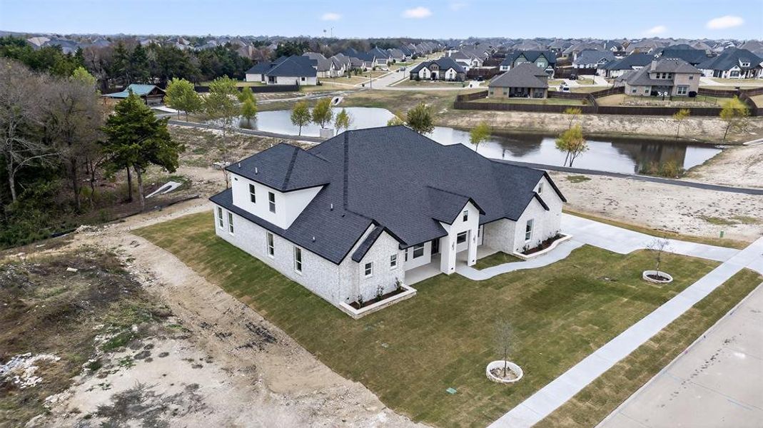 Front exterior of a new home in , Ovilla, TX, highlighting curb appeal (Image 40). Front exterior of a new home in , Ovilla, TX, highlighting curb appeal (Image 40).