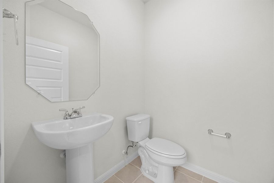 Half Bath in the Magnolia home plan by Trophy Signature Homes – REPRESENTATIVE PHOTO