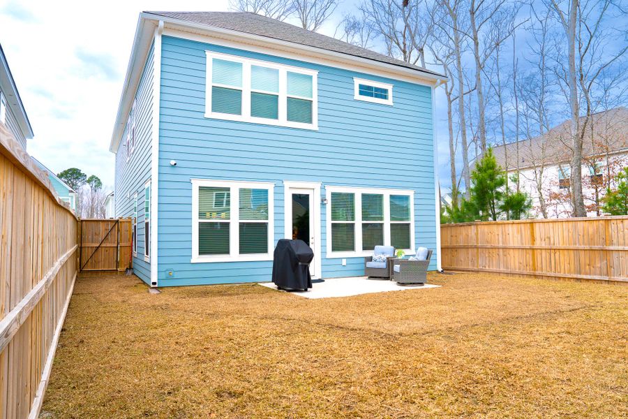 Exterior details and patio area of a home in Park's Edge at Carolina Bay, Charleston (Image 3). Exterior details and patio area of a home in Park's Edge at Carolina Bay, Charleston (Image 3).
