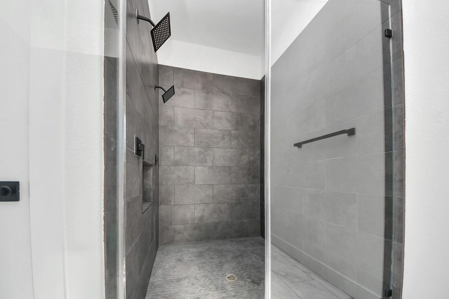 Spacious walk-in shower in the primary suite