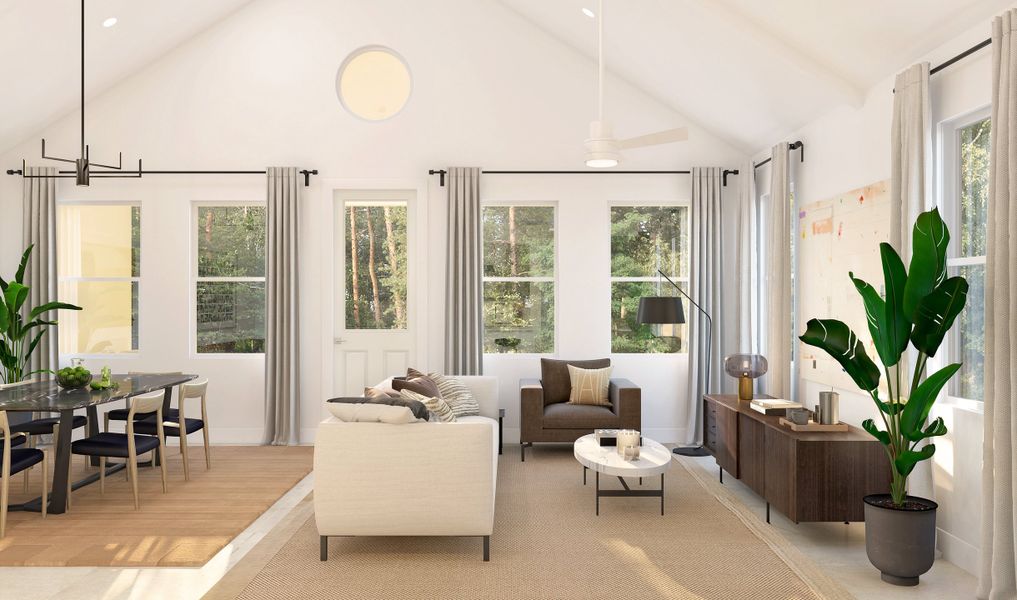 Great room with vaulted ceilings and painted white ceiling beams